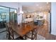Bright dining room with a wood table and chairs, open to kitchen and living room at 4304 Fly Rod Ter, Parrish, FL 34219