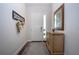 Bright entryway with hardwood floors, a console table, and a large mirror at 4304 Fly Rod Ter, Parrish, FL 34219