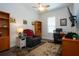 Home office with built-in shelving, comfortable recliner, and workspace at 4304 Fly Rod Ter, Parrish, FL 34219