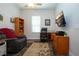 Bright home office featuring a desk, comfortable chair, and built-in shelving at 4304 Fly Rod Ter, Parrish, FL 34219