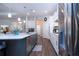 Open concept kitchen with white cabinets, stainless steel appliances, and a large island at 4304 Fly Rod Ter, Parrish, FL 34219