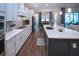 Open concept kitchen with white cabinets, large island, and stainless steel appliances at 4304 Fly Rod Ter, Parrish, FL 34219