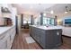 Spacious kitchen with a large island, stainless steel appliances, and hardwood floors at 4304 Fly Rod Ter, Parrish, FL 34219