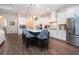 Bright kitchen featuring white cabinets, an island with seating, and stainless steel appliances at 4304 Fly Rod Ter, Parrish, FL 34219
