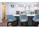 Modern kitchen with white cabinets, stainless steel appliances, and a large island at 4304 Fly Rod Ter, Parrish, FL 34219