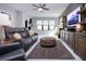 Home theater with large TV, comfortable seating and built-in shelving at 4304 Fly Rod Ter, Parrish, FL 34219
