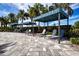 Poolside lounge chairs under striped cabanas at 4304 Fly Rod Ter, Parrish, FL 34219