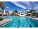 Community pool with lap lanes and surrounding lounge chairs at 4304 Fly Rod Ter, Parrish, FL 34219