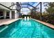 Inviting swimming pool with a screened enclosure at 4304 Fly Rod Ter, Parrish, FL 34219