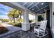 Charming porch with rocking chairs at 4304 Fly Rod Ter, Parrish, FL 34219