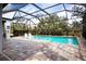 Inviting swimming pool with a screened enclosure at 4304 Fly Rod Ter, Parrish, FL 34219