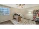 Home office with built-in desk and large bookcase at 4519 Trout River Xing, Ellenton, FL 34222