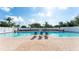 Inviting community swimming pool with plenty of lounge chairs at 4519 Trout River Xing, Ellenton, FL 34222