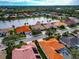 Aerial view showcasing a lakefront community with numerous houses at 4917 Sabal Lake Cir, Sarasota, FL 34238