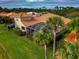 Aerial view of a house showcasing its backyard, pool, and landscaping at 4917 Sabal Lake Cir, Sarasota, FL 34238