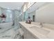 Modern bathroom with marble flooring and double vanity at 4917 Sabal Lake Cir, Sarasota, FL 34238
