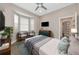 Guest bedroom with bay window and two armchairs at 4917 Sabal Lake Cir, Sarasota, FL 34238