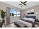 Bedroom with lake view and cozy sitting area at 4917 Sabal Lake Cir, Sarasota, FL 34238