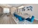 Elegant dining room with a large table and blue velvet chairs at 4917 Sabal Lake Cir, Sarasota, FL 34238