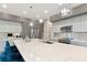 Modern kitchen with stainless steel appliances and a large island at 4917 Sabal Lake Cir, Sarasota, FL 34238