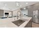 Modern kitchen with stainless steel appliances and large island at 4917 Sabal Lake Cir, Sarasota, FL 34238