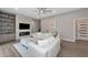 Bright living room with stone fireplace and built-in shelving at 4917 Sabal Lake Cir, Sarasota, FL 34238