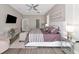 Elegant main bedroom with a plush bed and en-suite bathroom access at 4917 Sabal Lake Cir, Sarasota, FL 34238