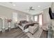 Spacious main bedroom with large bed and sitting area at 4917 Sabal Lake Cir, Sarasota, FL 34238