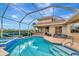 Relaxing pool and spa with a covered patio and outdoor bar at 4917 Sabal Lake Cir, Sarasota, FL 34238