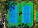 Aerial view of two well-maintained tennis courts at 4917 Sabal Lake Cir, Sarasota, FL 34238