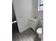 Simple bathroom with white vanity and gray tile flooring at 506 Houle Ave, Sarasota, FL 34232
