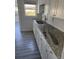 Modern kitchen with white cabinets and granite countertops at 506 Houle Ave, Sarasota, FL 34232