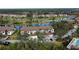 Aerial view of condo community with golf course and lake views at 5250 Hyland Hills Ave # 1515, Sarasota, FL 34241