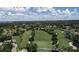 Aerial view of community, showing homes, golf course, and surrounding landscape at 5405 Champagne # 59, Sarasota, FL 34235