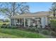 Beautiful exterior view of home featuring the sunroom and well maintained landscaping at 5405 Champagne # 59, Sarasota, FL 34235