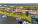 Aerial view showing house, dock, and surrounding neighborhood at 5607 Tidewater Preserve Blvd, Bradenton, FL 34208