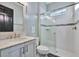 Bathroom with white vanity, marble countertop and shower at 5607 Tidewater Preserve Blvd, Bradenton, FL 34208