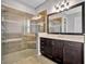 Bathroom features a walk in shower and double vanity at 5607 Tidewater Preserve Blvd, Bradenton, FL 34208