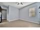 Light and airy bedroom with tile flooring and access to hallway at 5607 Tidewater Preserve Blvd, Bradenton, FL 34208