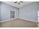Bright bedroom with tile floors and ceiling fan at 5607 Tidewater Preserve Blvd, Bradenton, FL 34208