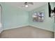 Light teal bedroom with tile floors and a ceiling fan at 5607 Tidewater Preserve Blvd, Bradenton, FL 34208