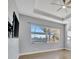 Bright bedroom with large window and ceiling fan at 5607 Tidewater Preserve Blvd, Bradenton, FL 34208