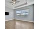 Spacious bedroom with large window and tile floors at 5607 Tidewater Preserve Blvd, Bradenton, FL 34208