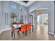 Bright dining area with modern table and orange chairs at 5607 Tidewater Preserve Blvd, Bradenton, FL 34208
