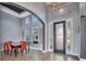 Bright dining area with a modern table and orange chairs at 5607 Tidewater Preserve Blvd, Bradenton, FL 34208