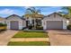 Two-story home with two-car garage and attractive landscaping at 5607 Tidewater Preserve Blvd, Bradenton, FL 34208