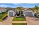 Two-story home with two-car garage and attractive landscaping at 5607 Tidewater Preserve Blvd, Bradenton, FL 34208