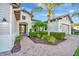 Attractive front entrance with brick walkway and lush landscaping at 5607 Tidewater Preserve Blvd, Bradenton, FL 34208