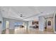 Open concept Gathering room with kitchen and view to pool at 5607 Tidewater Preserve Blvd, Bradenton, FL 34208
