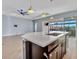 Open kitchen features a large island and breakfast bar at 5607 Tidewater Preserve Blvd, Bradenton, FL 34208
